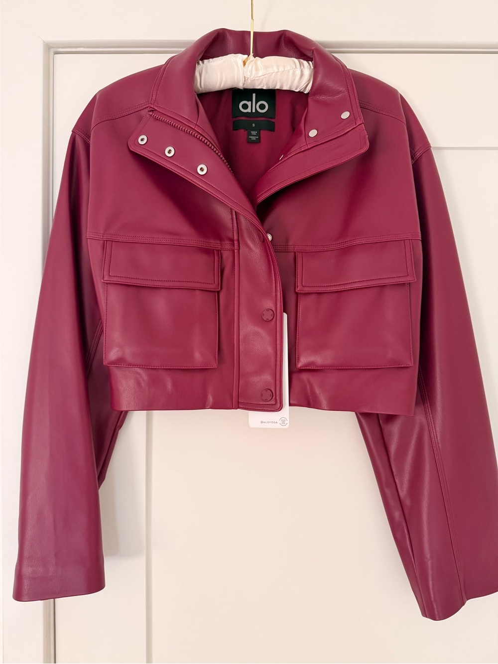 ALO Yoga Cropped Faux Leather Jacket in Wild Berry